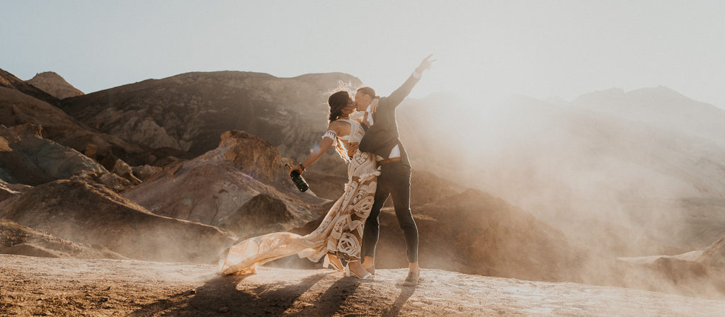 bride and groom celebrating elopement in Death Valley National Park