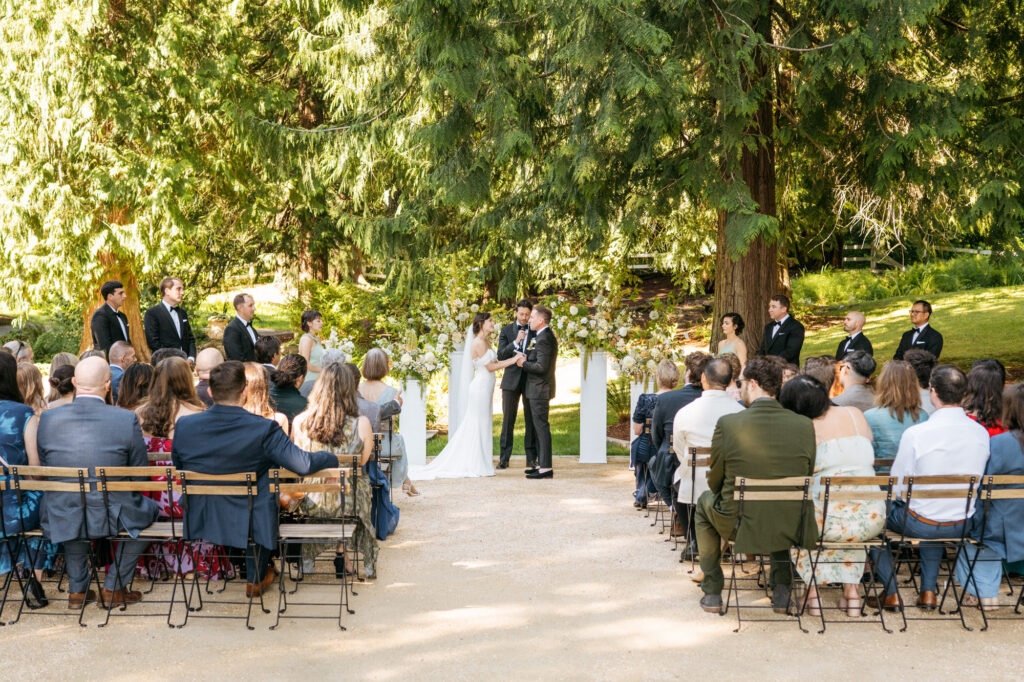 Candid wedding photography of bride and groom during their wedding ceremony at Chateau Lill.