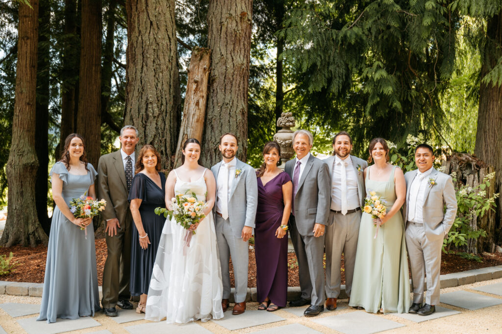 Formal portrait of family members of a bride and groom on their wedding day.