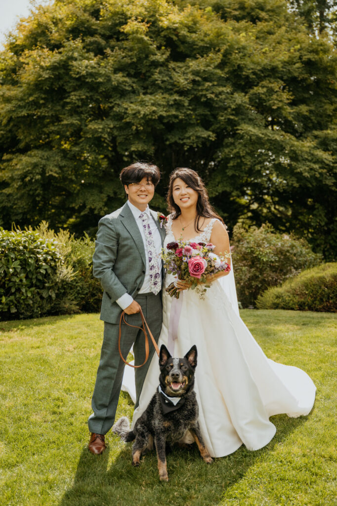 Candid wedding photography of a couple with their dog at Twin Willow Gardens